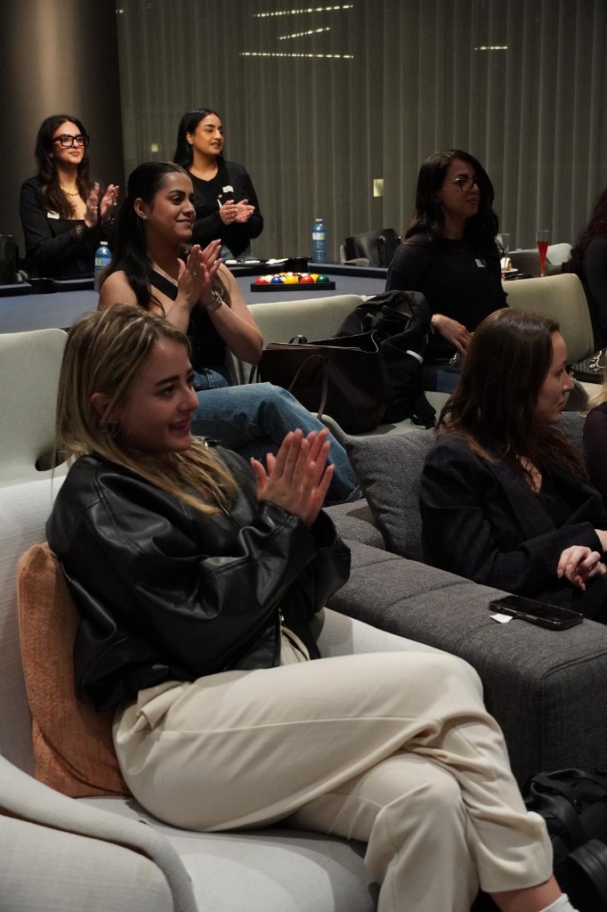 Attendees clapping and smiling during a LaverageAI workshop